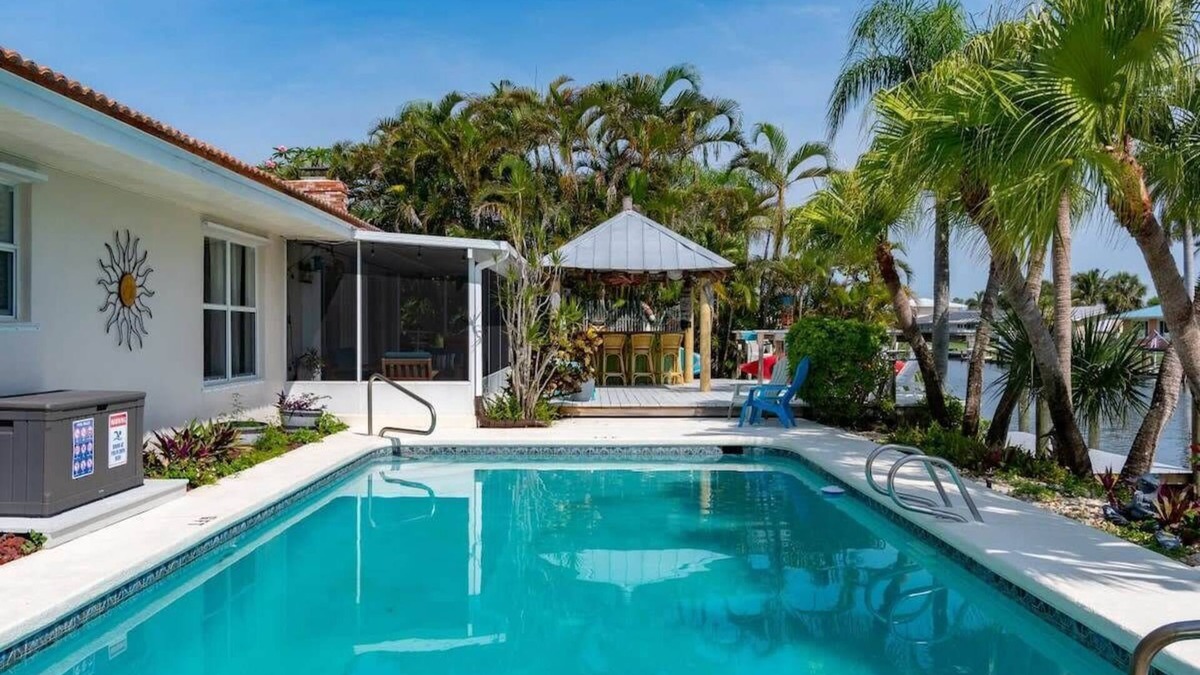 Cocoa Isles House | Cocoa Beach Waterfront Home with Tiki Bar and Pool