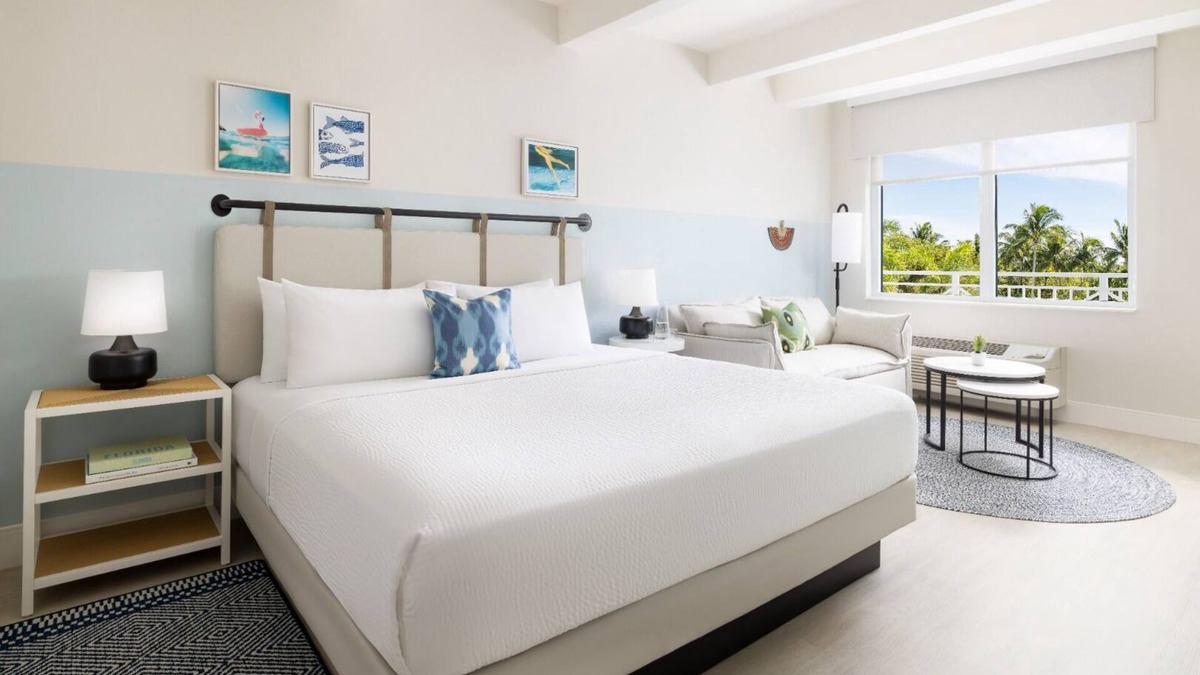 New Town Hotel | Colorful Stay at Blue Flamingo | Poolside Bar, Lawn Games, Music & Fire Pits