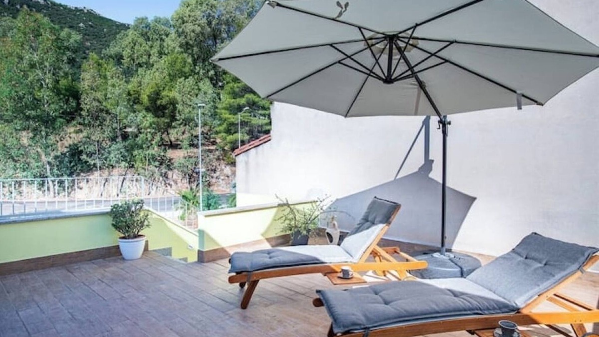 Guspini House | Comfortable room with private balcony and view