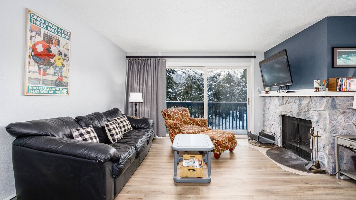 Alyeska Condo | Condo with lanai, mountain view, fireplace, & spiral staircase