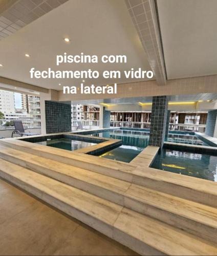 Caicara Apartment | condominio clube com piscina climatizada com fechamento em vidro - Vila Caiçara - Praia Grande 4 adultos e 1 criança até 12 anos