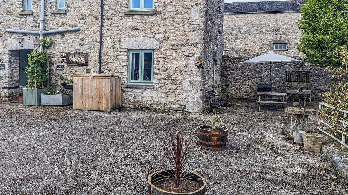 Meathop Cottage | Corner Cottage is super cosy and immaculately presented, benefitting also from a private seating are