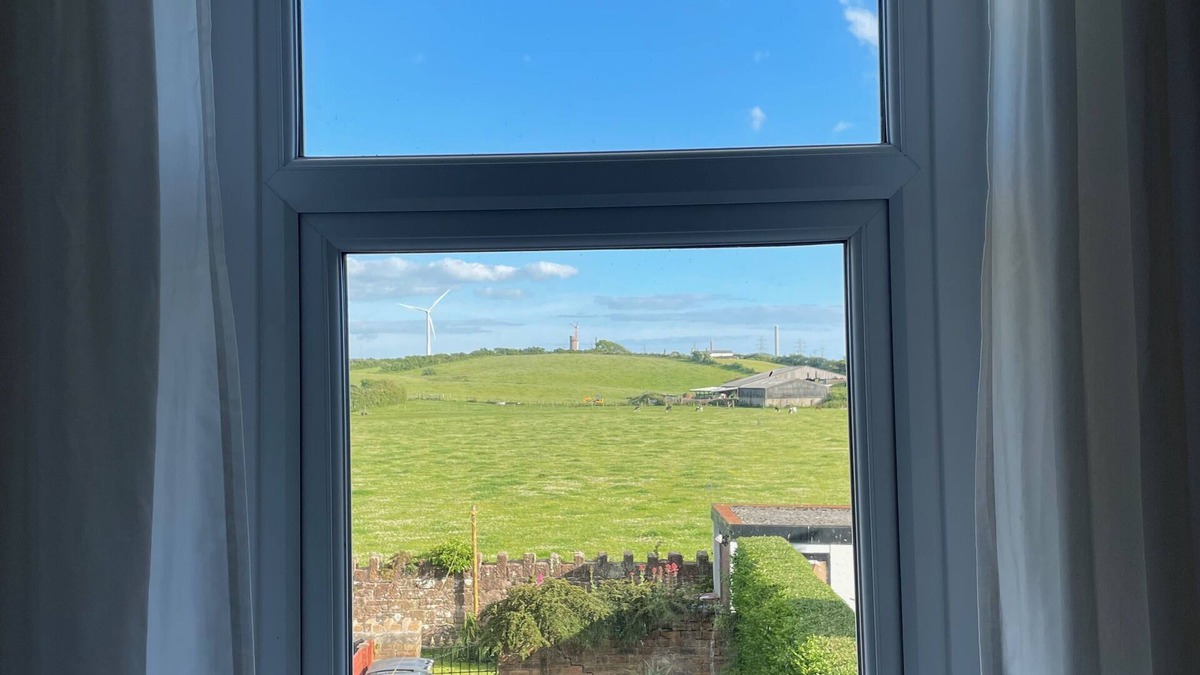 Beckermet House | Cosy village house walking distance to beach and 2 pubs.