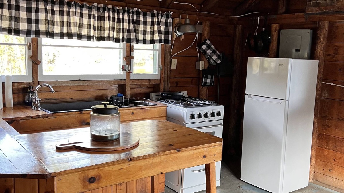Rangeley Plantation Cabin | Cozy cabin on the water with fantastic views of Mooselookmeguntic Lake.