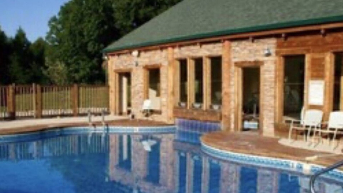 Spencer Cabin | Cozy cabin with fire pit, hot tub, and pool, and a swing set in the backyard!