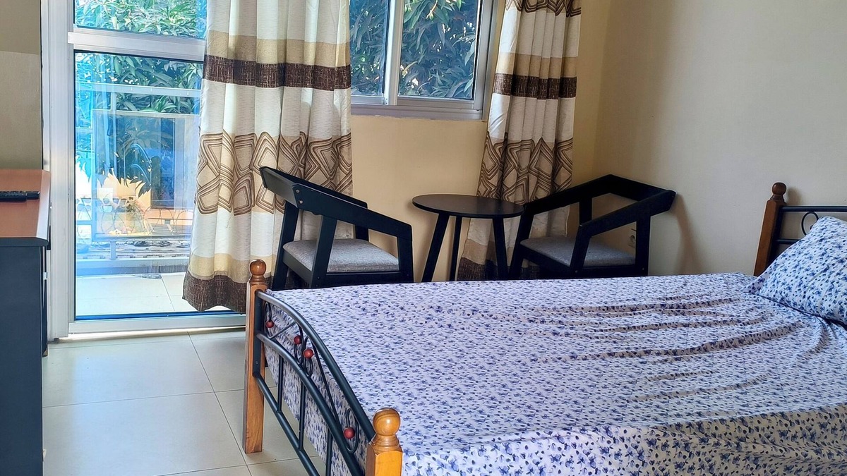 Limete House | Cozy Guest Room in Kinshasa with Balcony and Partial Air-Conditioning