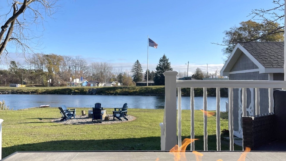 Oscoda Cottage | Cozy riverfront cottage with an easy beach-inspired coastal MI vibe!