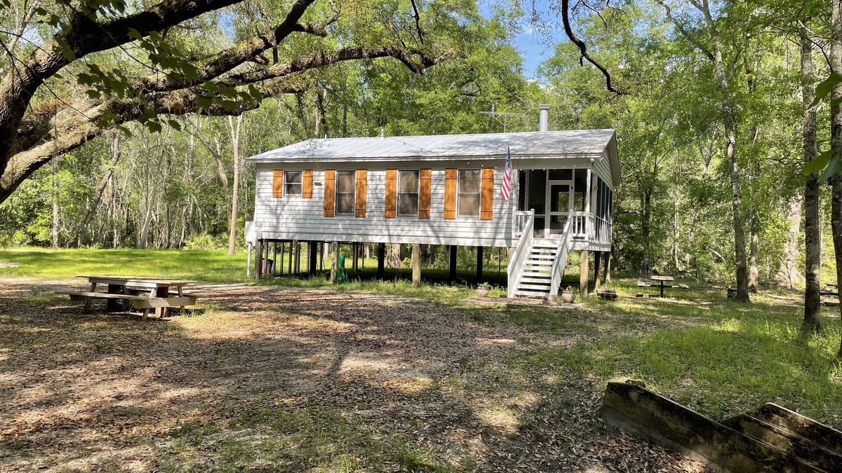 Claxton Cabin | Creekside Hunting and Fishing Cabin overlooking Lotts Creek on 190 acres