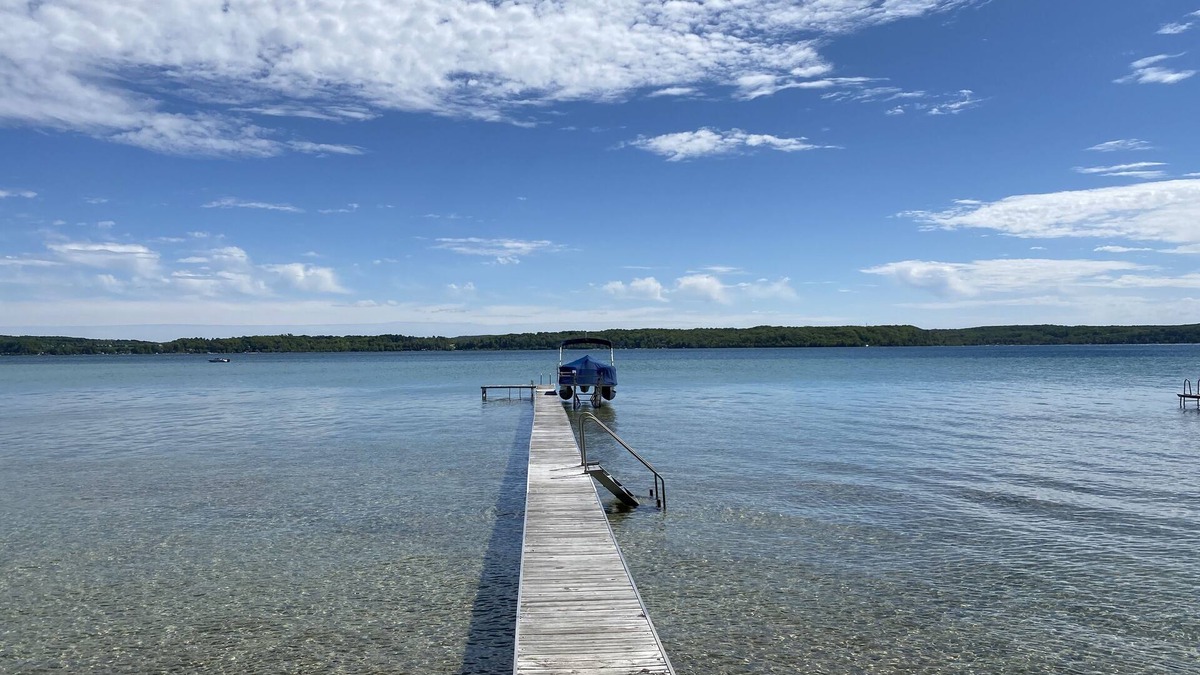 Lake Township House | Crystal Lake Waterfront Cottage with Private Dock, Yard, & Hot Tub