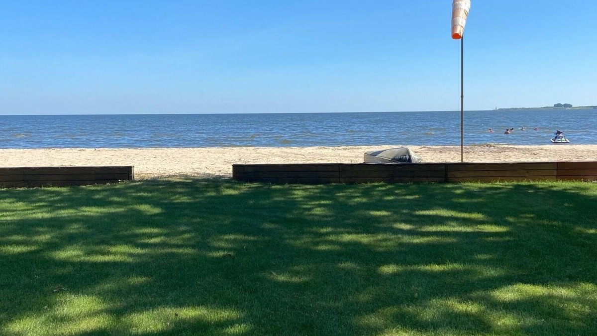 Bay City House | Cute house on Saginaw Bay with hot tub on private beach.