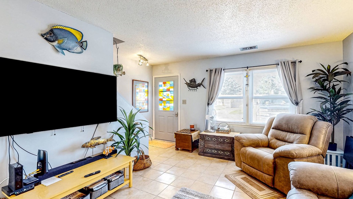 Atlantic Beach Condo | Dog-friendly coastal retreat with games, W/D, & patio - walk to the beach