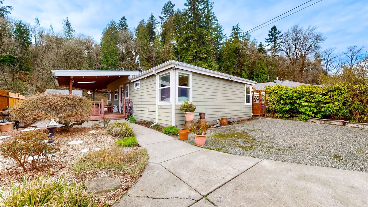 Maplewood House | Dog-friendly riverfront home with patio, golf nearby, enclosed yard, & W/D