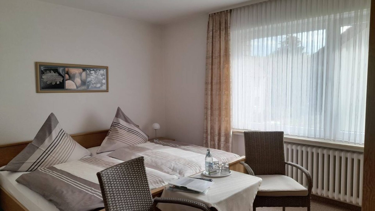 Bad Driburg Apartment | Double room, bathroom, WC - vacation apartment and guest room Iburgblick