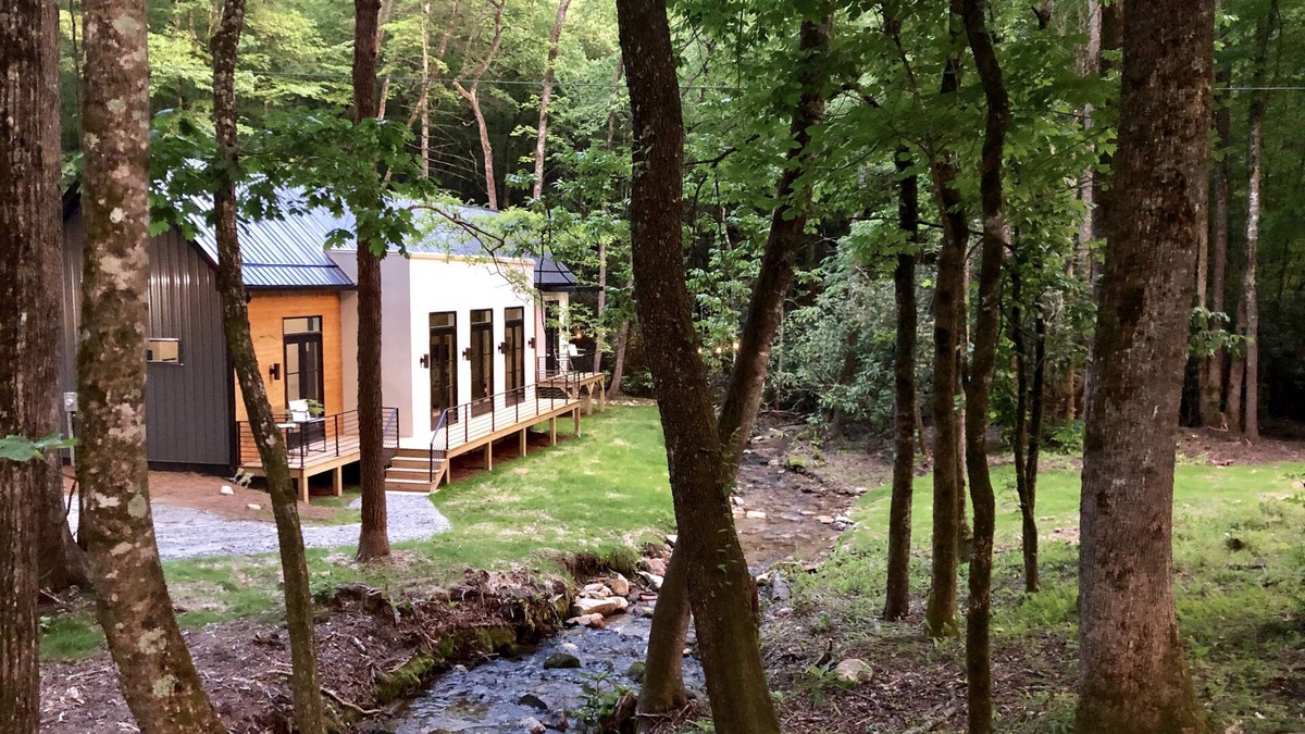 Scaly Mountain House | E Ranch is a modern, creek side, Scandinavian barnhouse.