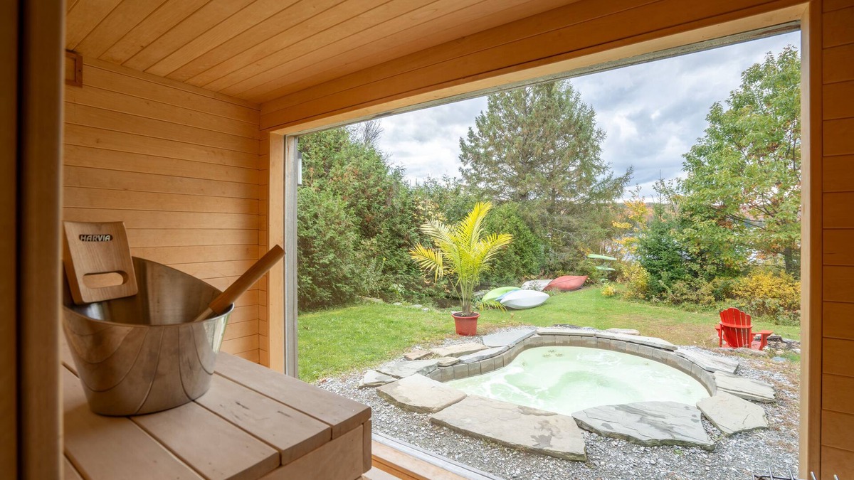 Eastman Cottage | Eastern Townships waterfront with salt-in-ground spa, sauna, pool table and wifi