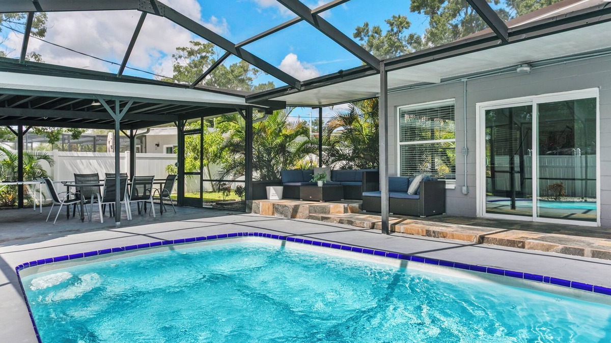 Tampa House | Elegant 4BR Family Retreat with Heated Pool This beautifully appointed home offers 4 spacious bedrooms, 2 modern bathrooms, AC, private pool and sleeps up to 10 guests in total comfort.