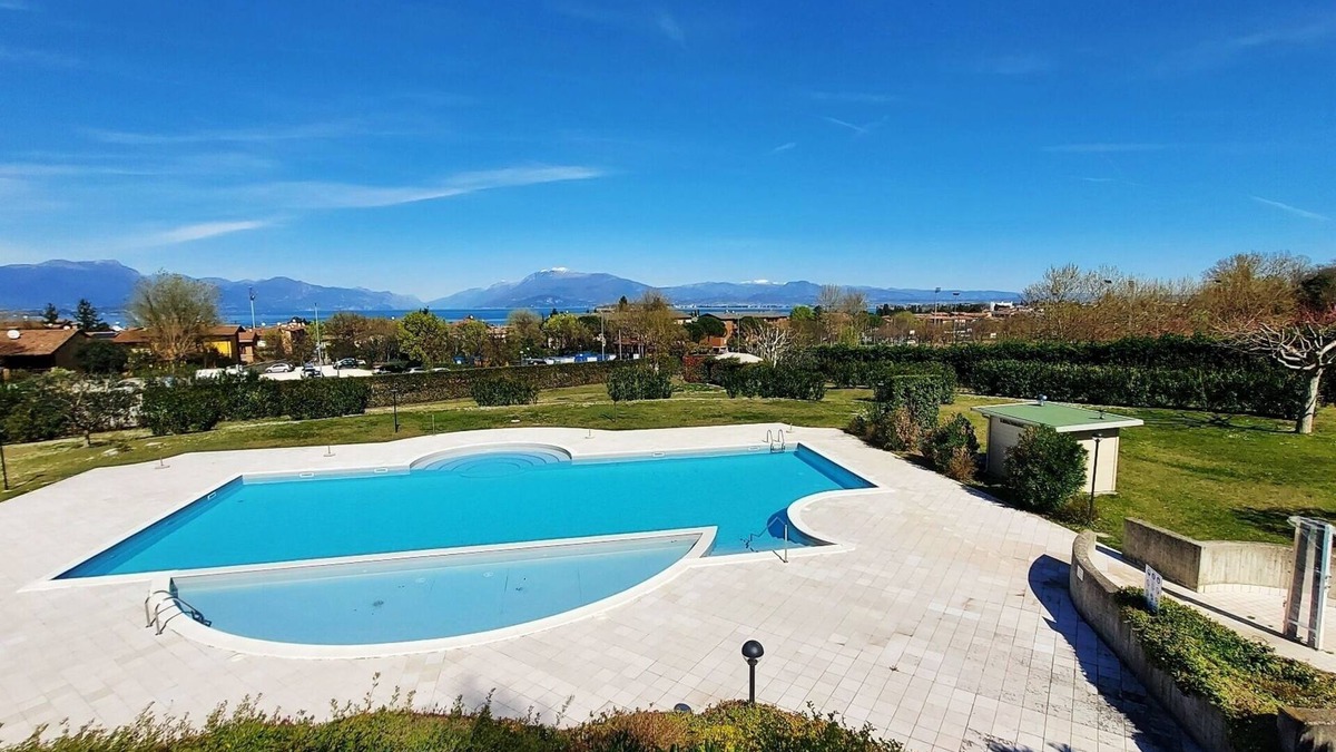 Desenzano del Garda Apartment | Elegant flat with large terrace in residence with swimming pool