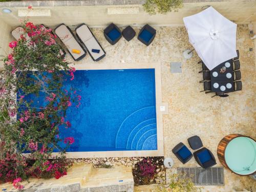 Xewkija Villa | Ellie Boo Farmhouse with Pool and Hot Tub and Games Room