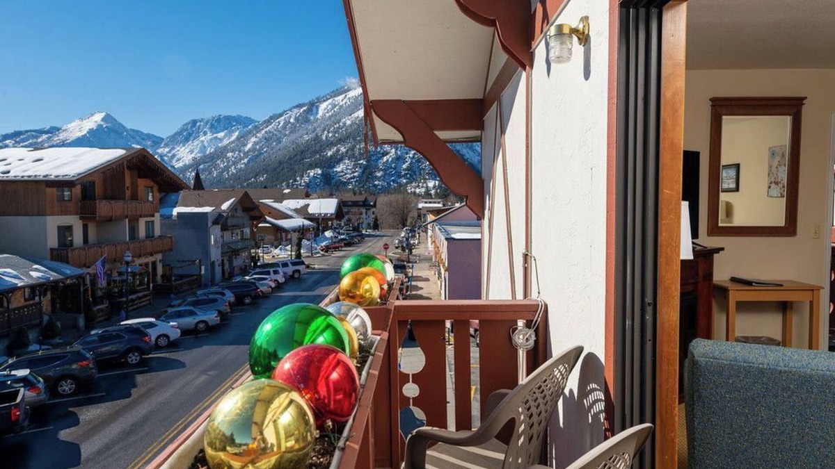 Leavenworth Hotel | Enjoy easy walking access to all Leavenworth has to offer after a relaxing night in our King room with a cozy fireplace and Juliette balcony.