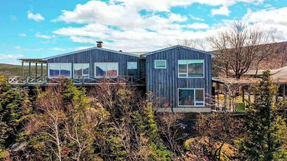White Point Cottage | Enjoy the stunning views of the Cape Breton Highlands atop this cliffside estate
