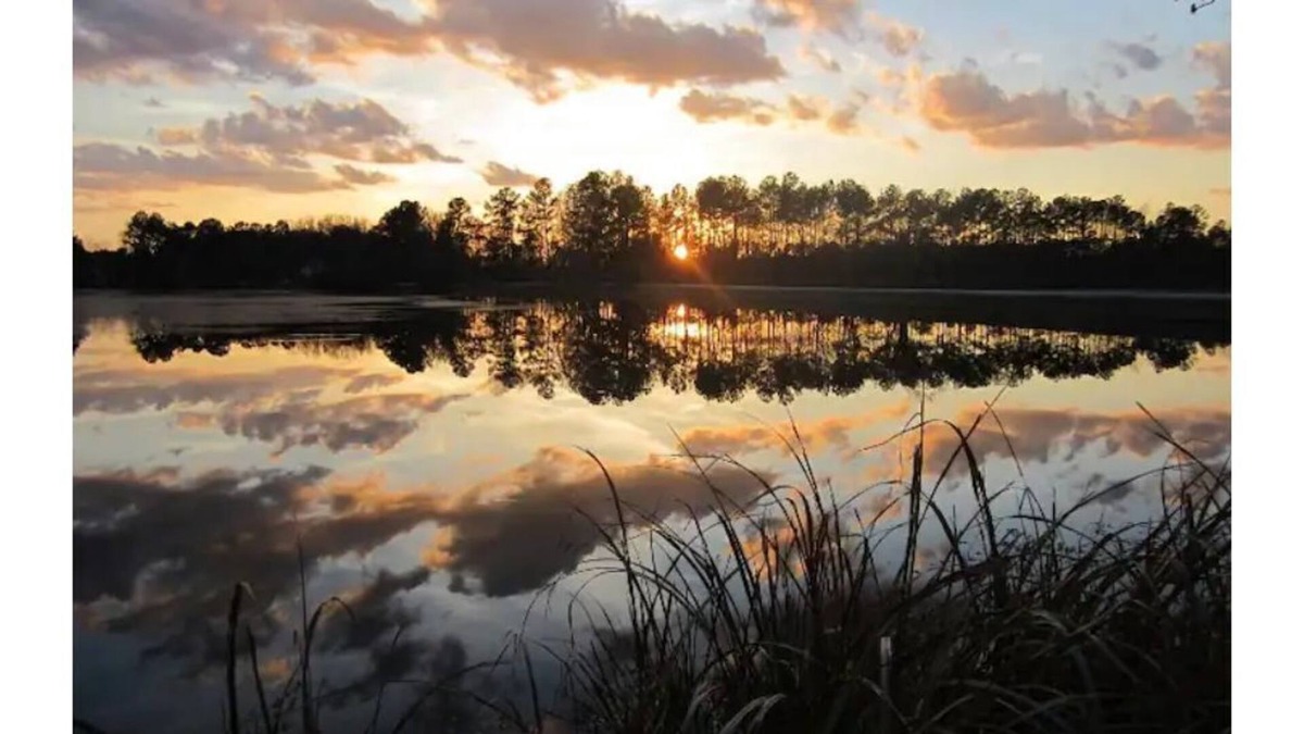 Cordesville House | Enjoy the sunrise on private dock on lake Haskie