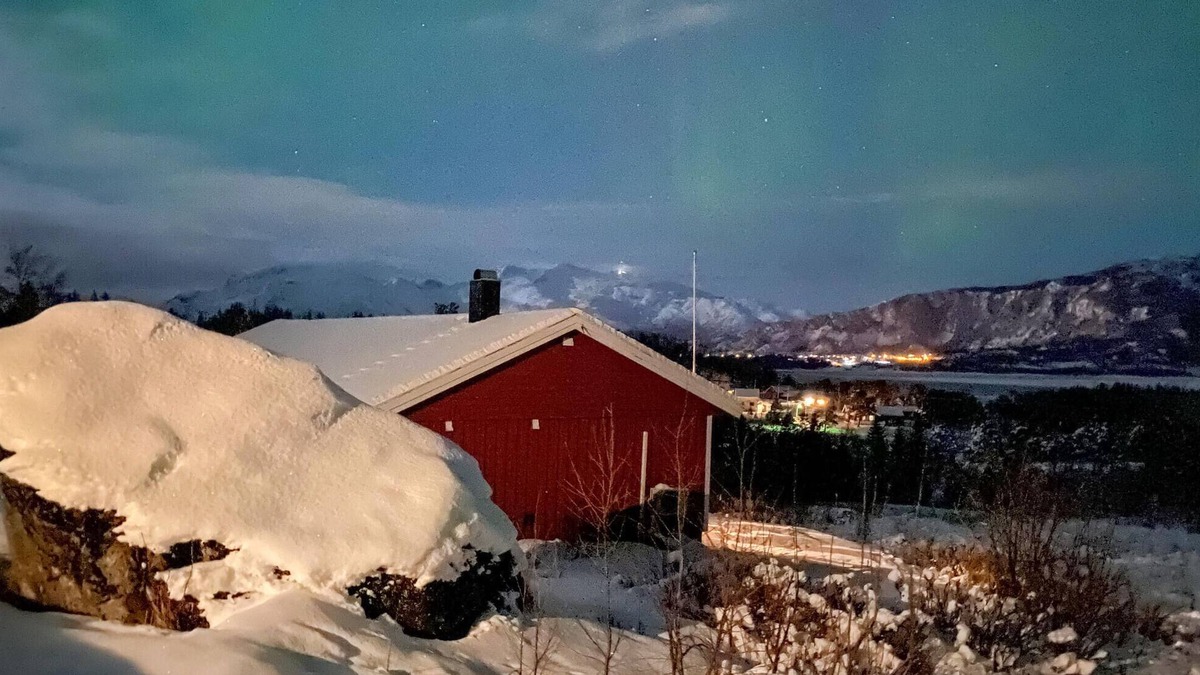 Steigen House | Enjoy the view of mountains and forests in this cozy vacation home.