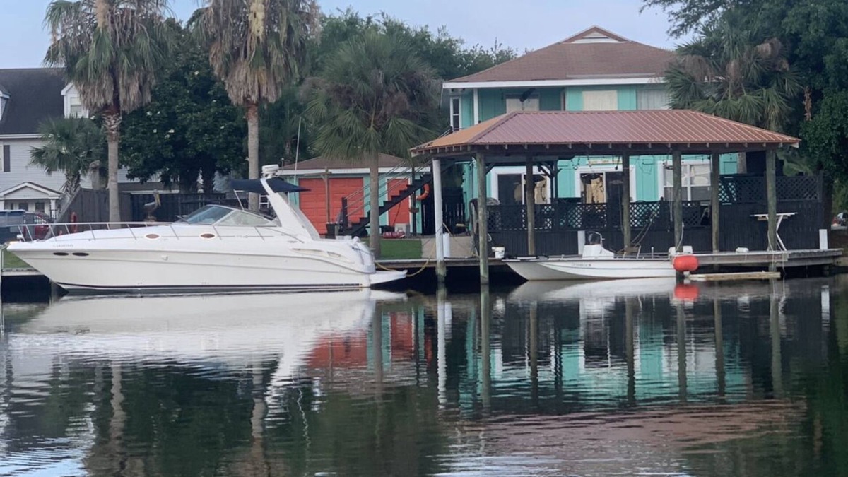 New Orleans East Area House | Enjoy this serene waterfront getaway with boat dock and deck.