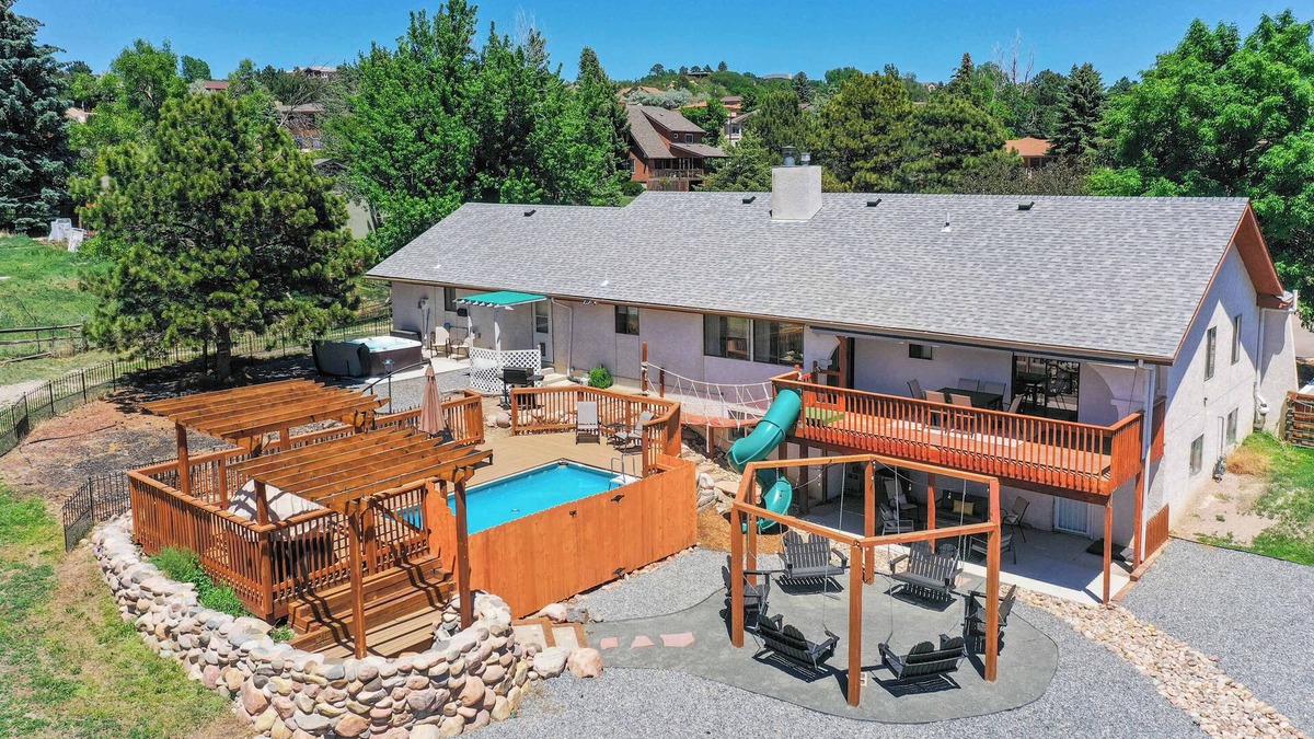Park Vista House | Evergreen Luxe! Backyard Oasis w/Pool & Hot Tub!