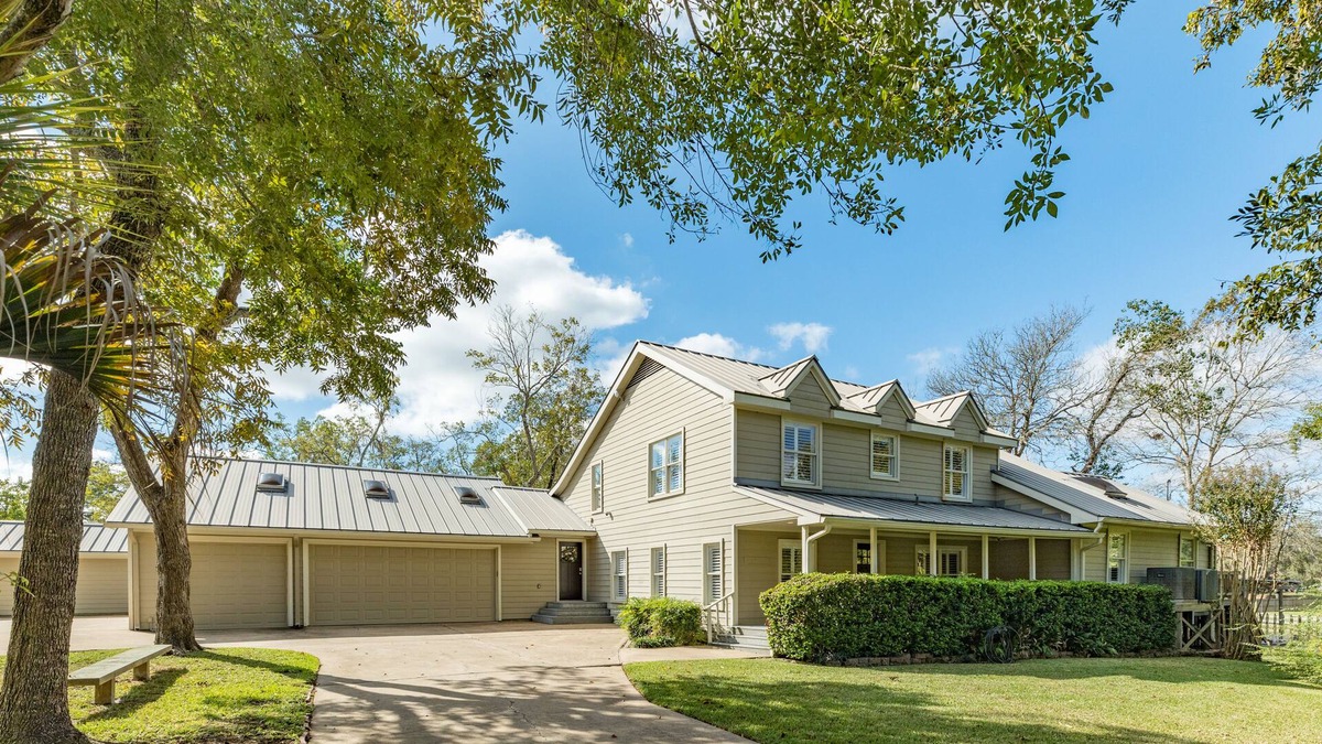 Dickinson House | Expansive home on the water with dock, large deck, shared pool & central AC