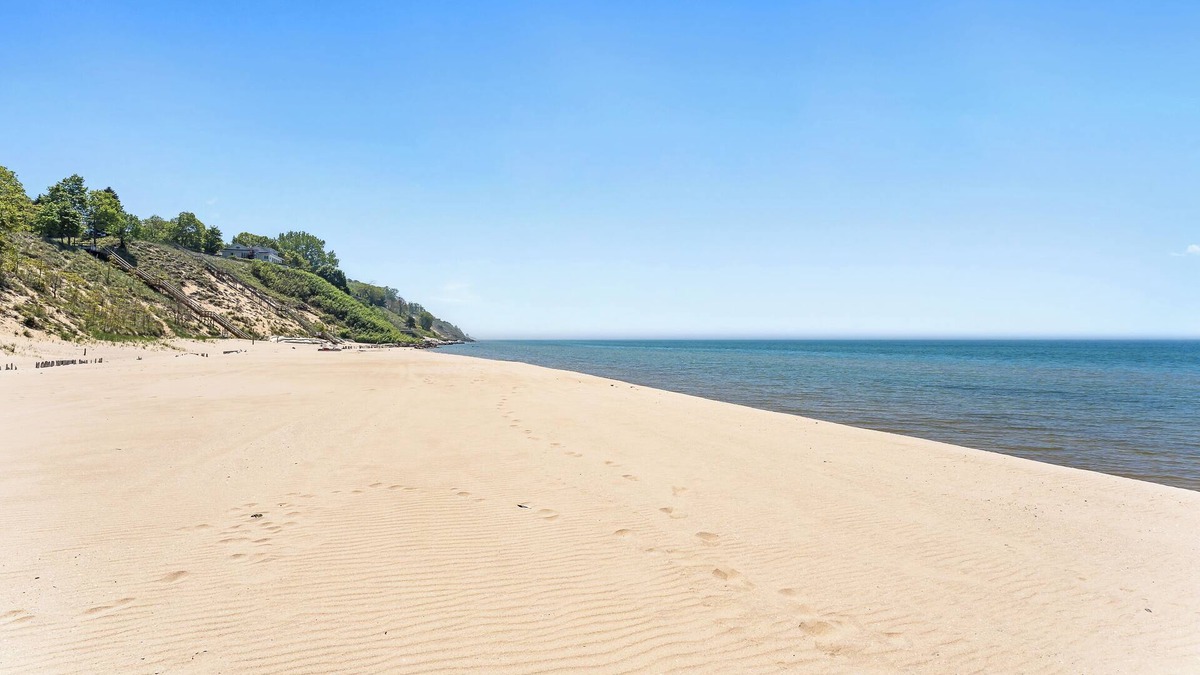 Port Sheldon House | Experience luxury at Lakefront Villa, a spacious 5-bedroom retreat - stunning lake views.