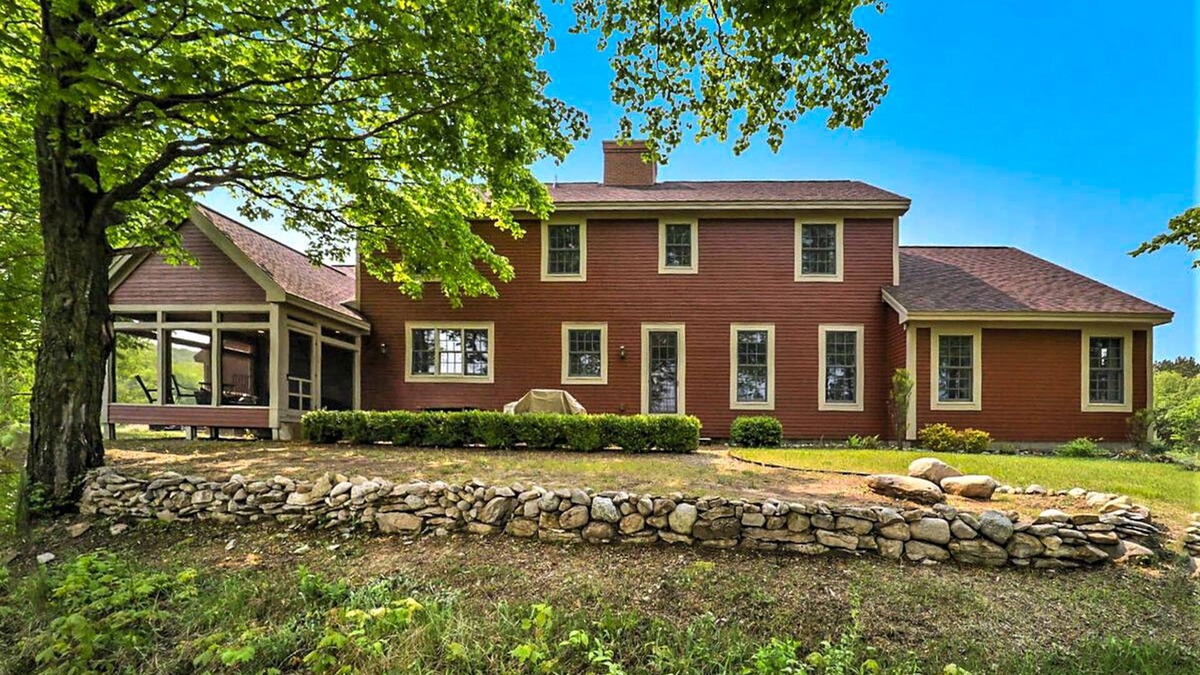 Maple City House | Exquisite Cape Cod home with large yard, fireplace, central AC, & W/D