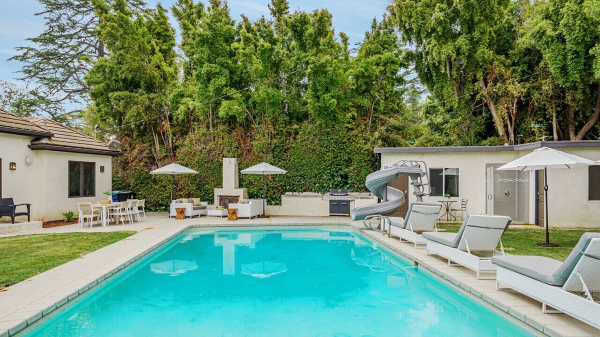 Sherman Oaks House | Exquisite Oasis Universal Pool slide laundry