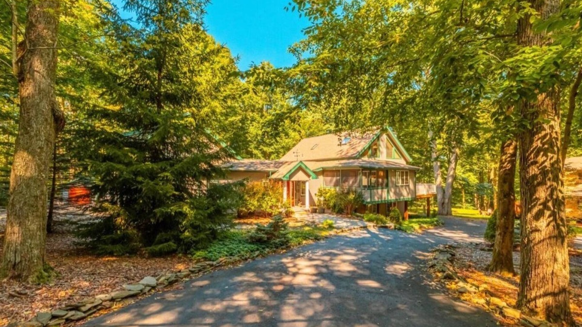 Pocono Lake House | Family friendly home away from home. Indoor hot tub. Fire pit. Game room.