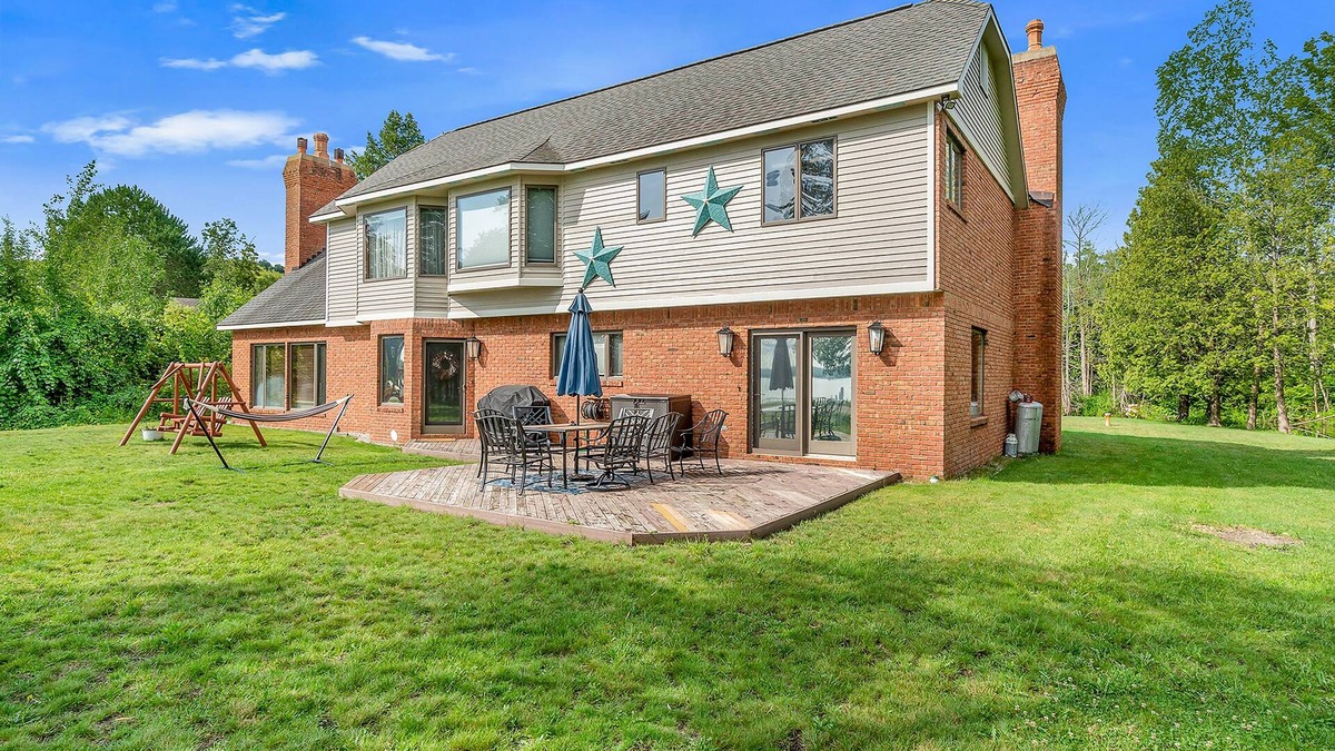 Lake Township House | Family-Friendly Lake View Home with Patio, Grill, Deck, Fireplace, & Free WiFi