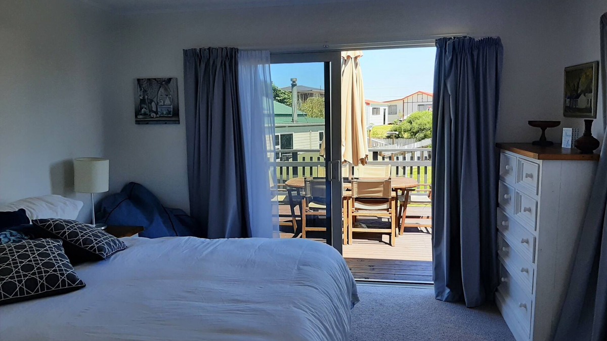 Waitarere Beach House | Family friendly, fully fenced bach, close to the beach, shops and playground.