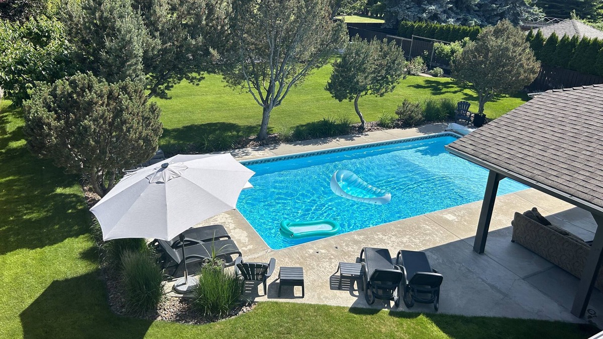 Crawford House | Family Vacation Oasis: Heated Pool, 5 bedrooms, 1/2 acre property, covered patio