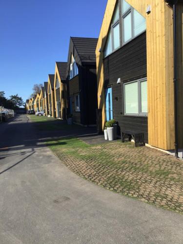 Ny Hellesund House | Feriehus i Søgne Sørlandet tilgang til basseng boblebad badstu