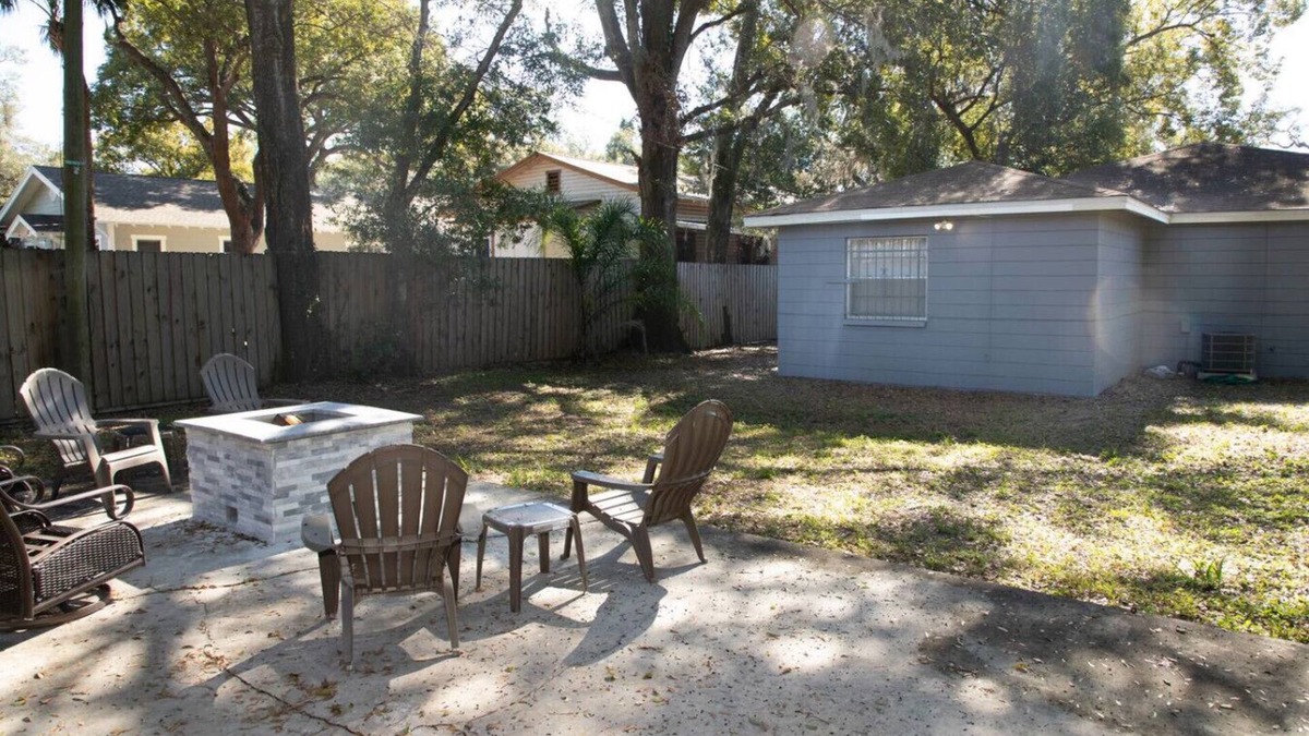Tampa Heights Apartment | Fire Pit Fenced Backyard Board Games