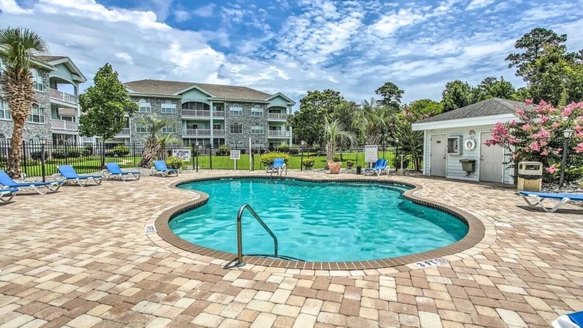 Central Myrtle Beach Condo | First Floor Updated Coastal Summer Retreat at Magnolia Place - Pool View