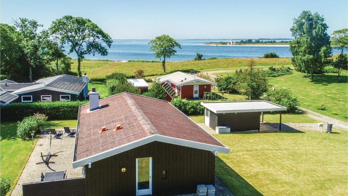 Mesinge House | From this cottage you have a fantastic view over the sea and to Enebær Odde with its characteristic