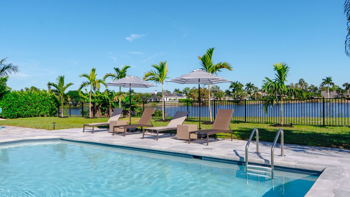 Palm River Estates House | Fully Updated Lake Front Home With Heated Pool!