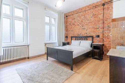 Gliwice Apartment | Gliwice Industrial Brick Style Apartment by BookingHost