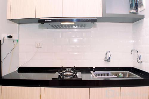 Pekayon Jaya Apartment | Great Location and Simply Studio at Grand Kamala Lagoon Apartment By Travelio