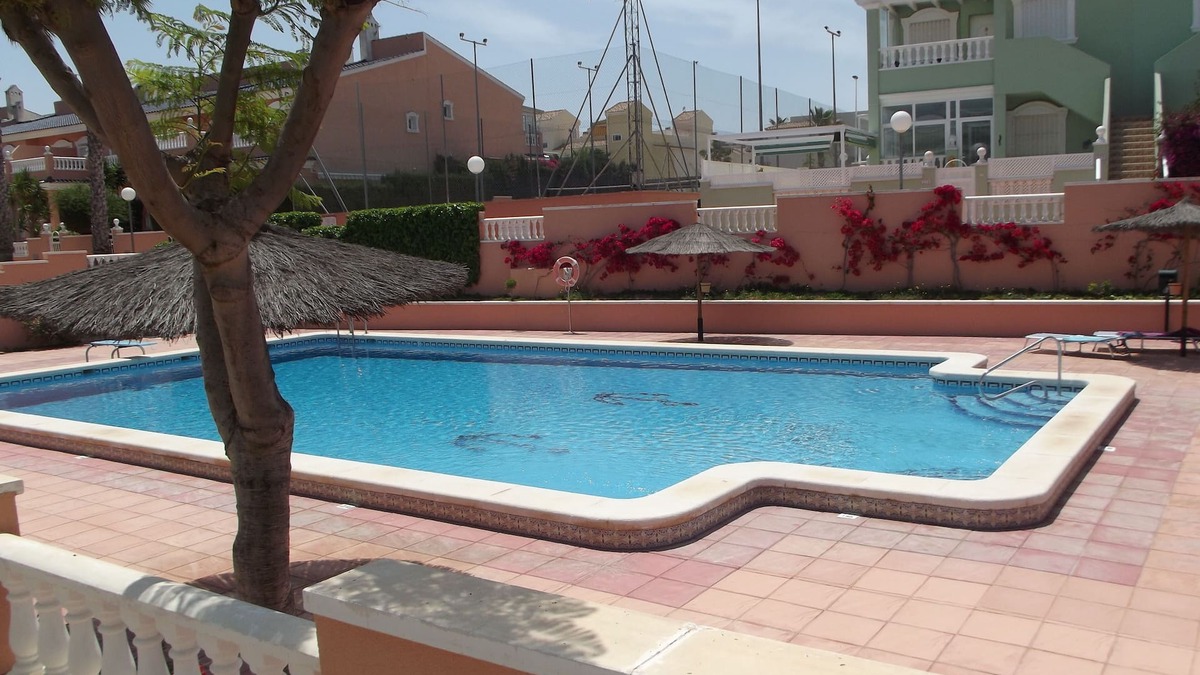 Los Arenales del Sol Apartment | Ground floor corner apartment with WIFI, spacious sunbathing area and pool views