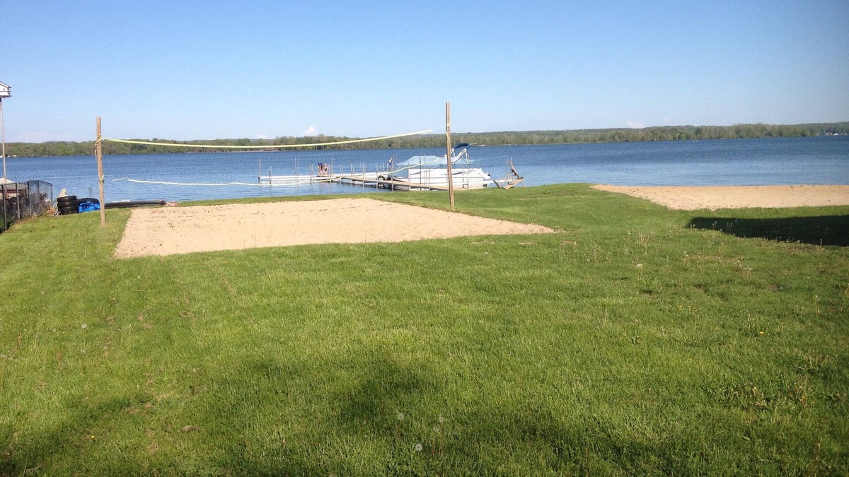 Shelbyville Cottage | Gun Lake Vacation Rental, Sandy beach, docks, picnic tables, kids play grounds