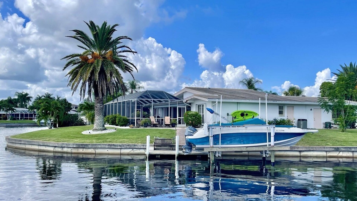 Punta Gorda House | Heated pool, Tropical waterfront home , Dock, Gulf access minutes from downtown.