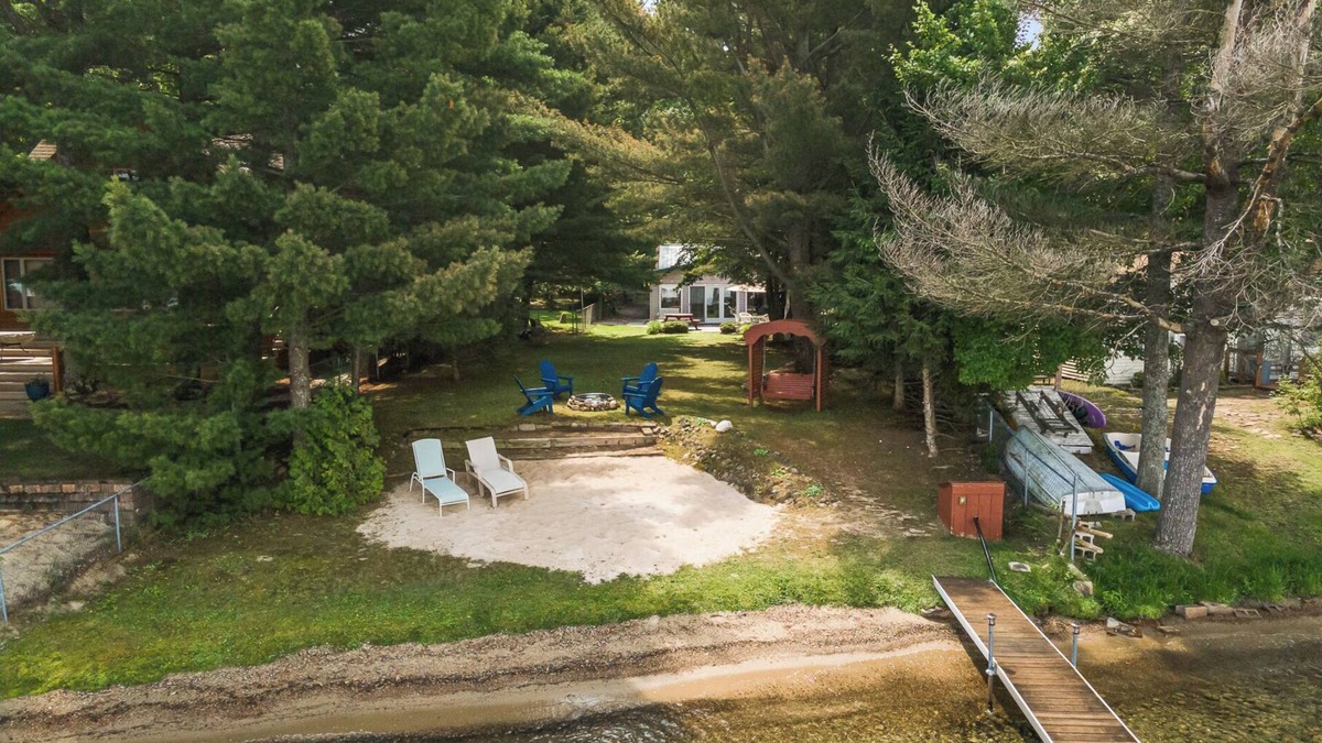 Higgins Lake House | Higgins Lake Private Beachfront Home w/Dock, Boat Mooring, Sunset & Sunrise View