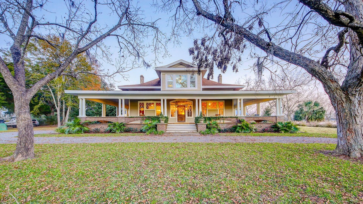 Meggett House | Historic charmer with private pool, outdoor kitchen. wrap-around porch, & dock
