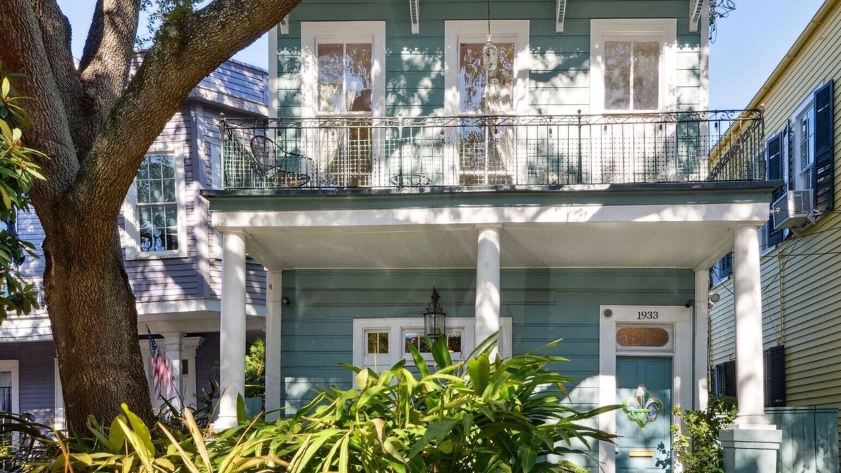 Seventh Ward Apartment | Historic Property With Balcony Lookout into Trees and Pre Civil War buildings.