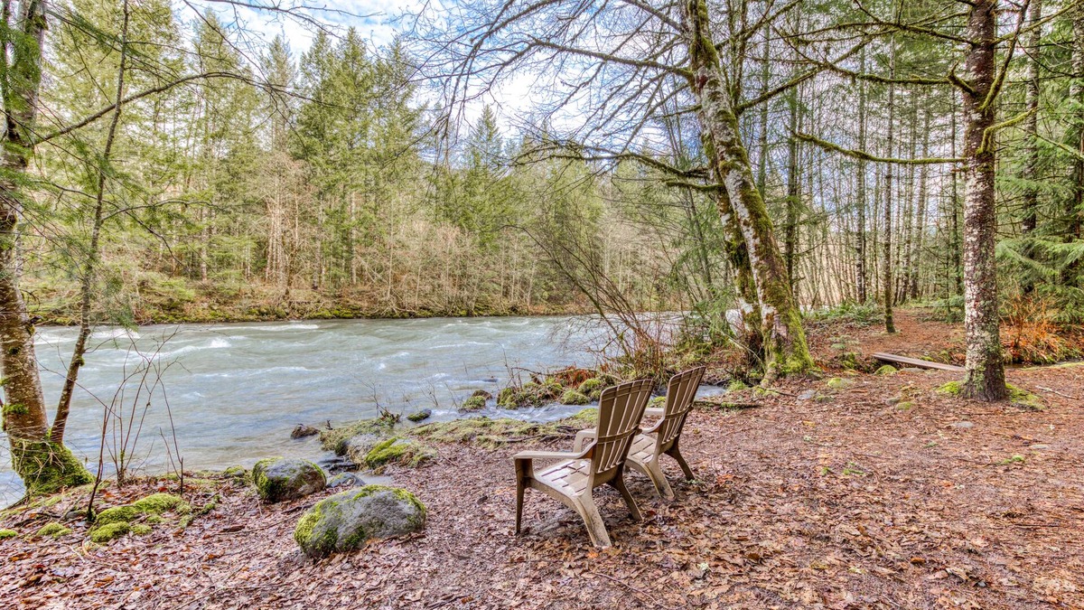 Mount Hood Village Cabin | Historic riverfront Steiner cabin in forest with firepit, deck, & patio lounging